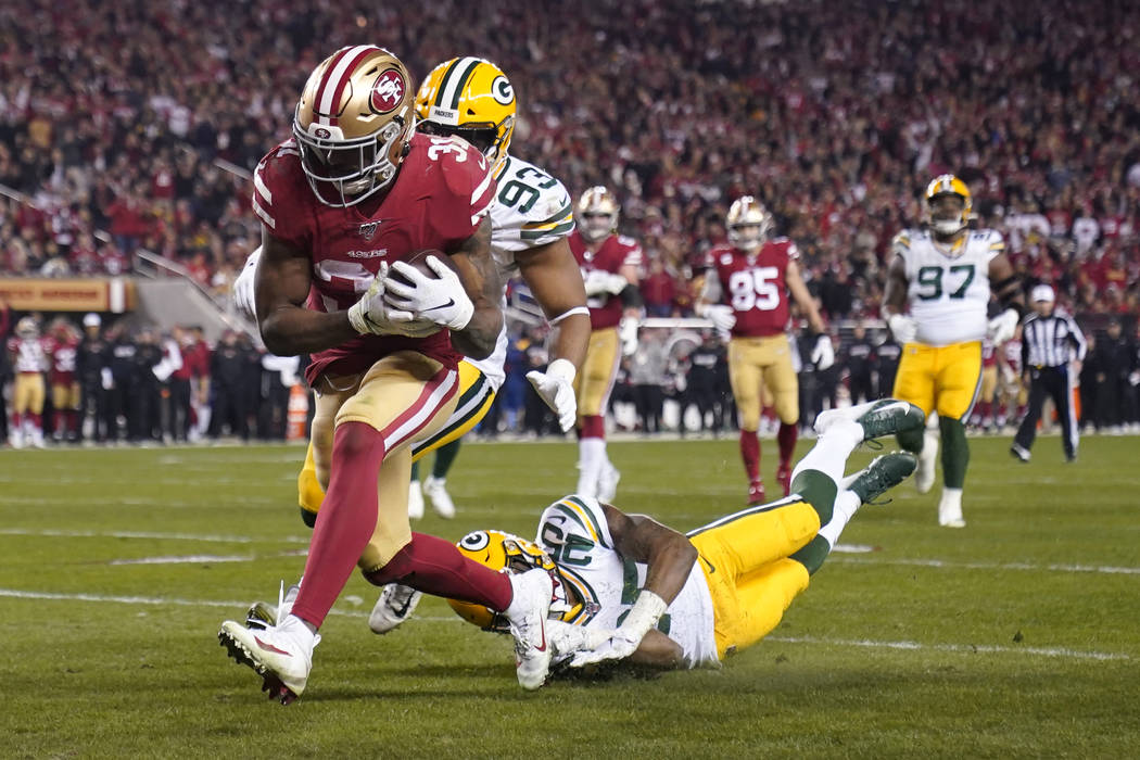 San Francisco 49ers running back Raheem Mostert (31) runs for a touchdown against the Green Bay ...