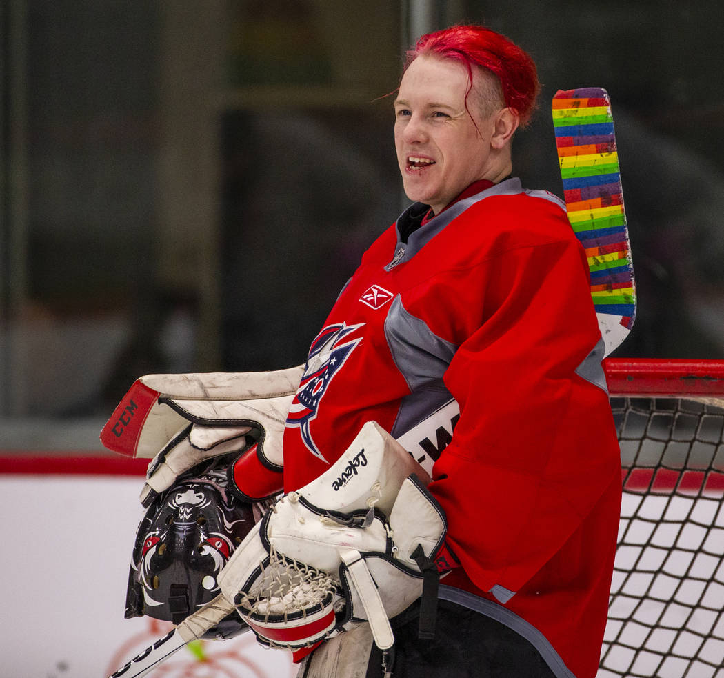 Flamingos goalie shares a laugh with teammates while facing the Blackjacks in their semi-finals ...