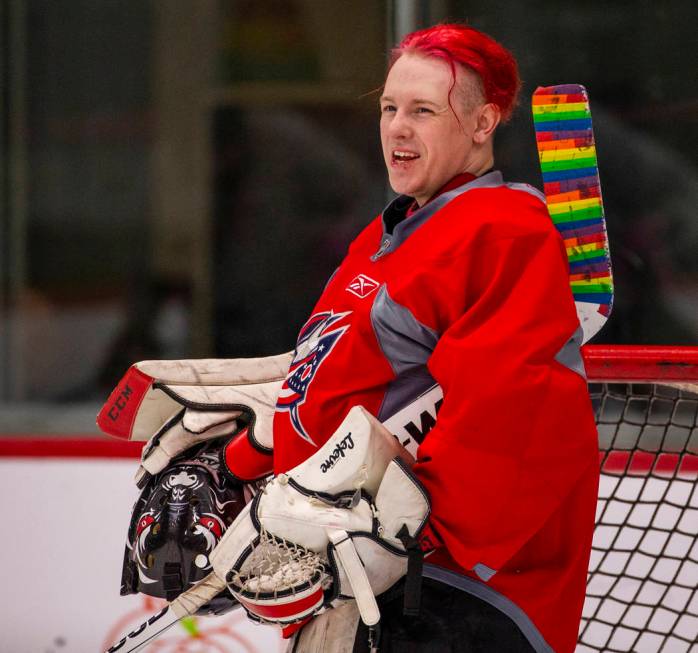 Flamingos goalie shares a laugh with teammates while facing the Blackjacks in their semi-finals ...