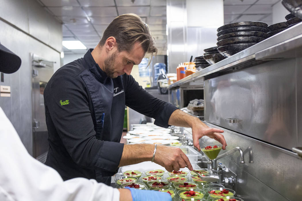 Chef Yuri Szarzewski of EATT Groumet Bistro prepares the chilled sweet pea, spinach and mint so ...