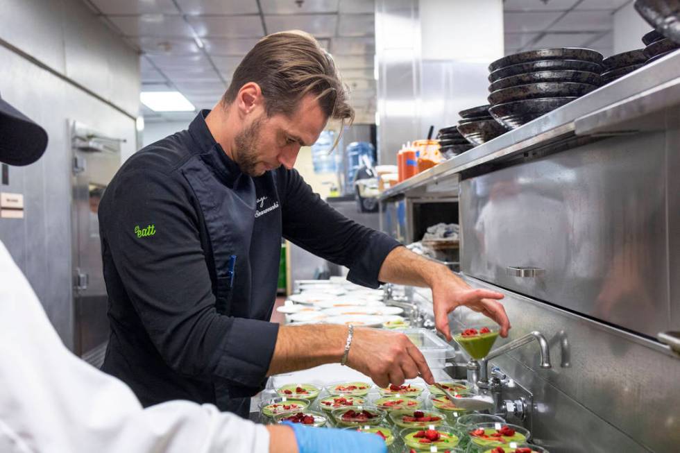 Chef Yuri Szarzewski of EATT Groumet Bistro prepares the chilled sweet pea, spinach and mint so ...