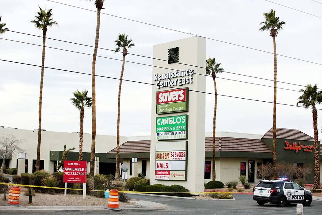 Police tape closes off the the Renaissance Center East shopping complex in Las Vegas on Monday, ...