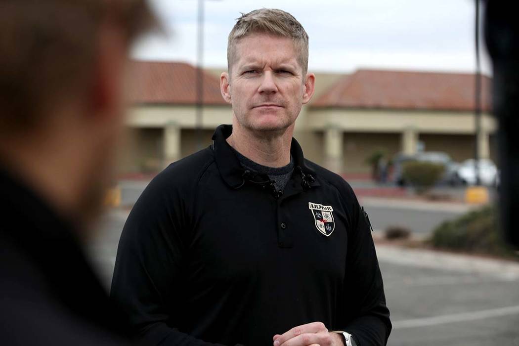 Las Vegas police Lt. Zachary Burn gives a briefing across the Renaissance Center East shopping ...