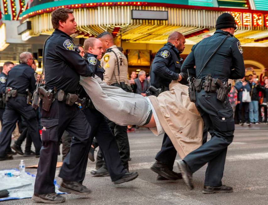 Las Vegas Metropolitan Police officers arrest local activist Joey Lankowski for blocking Casino ...