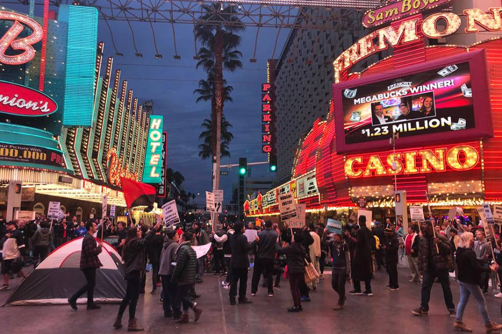 Activists gathered Monday, Jan. 20, 2020, in downtown Las Vegas to protest the two controversia ...