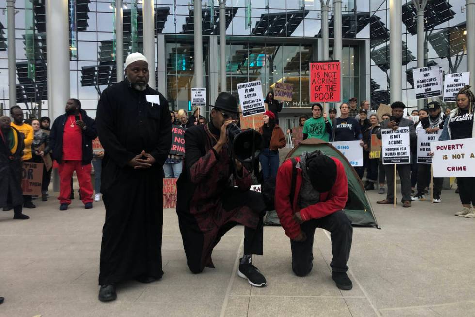 Prayers are said before protests Monday, Jan. 20, 2020, in downtown Las Vegas. Activists gather ...