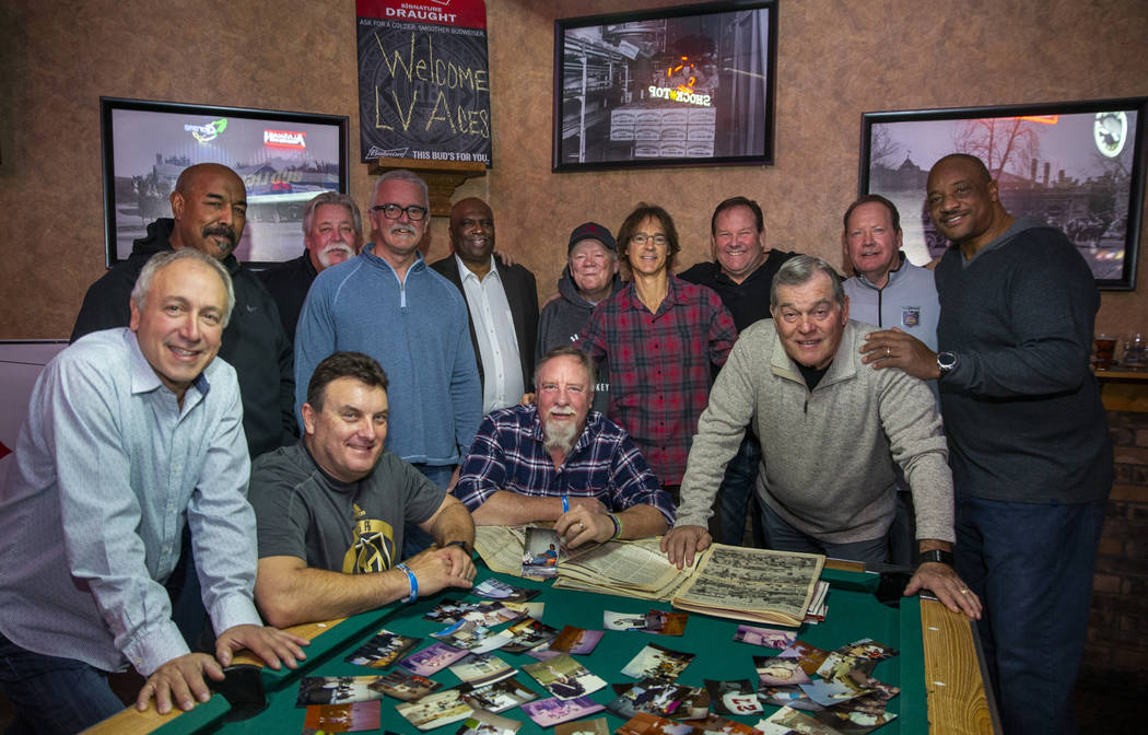 Former players and their sponsor's son gather for a photo during the Las Vegas Aces slow-pitch ...