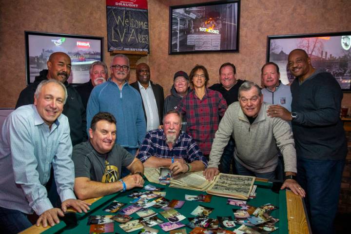 Former players and their sponsor's son gather for a photo during the Las Vegas Aces slow-pitch ...