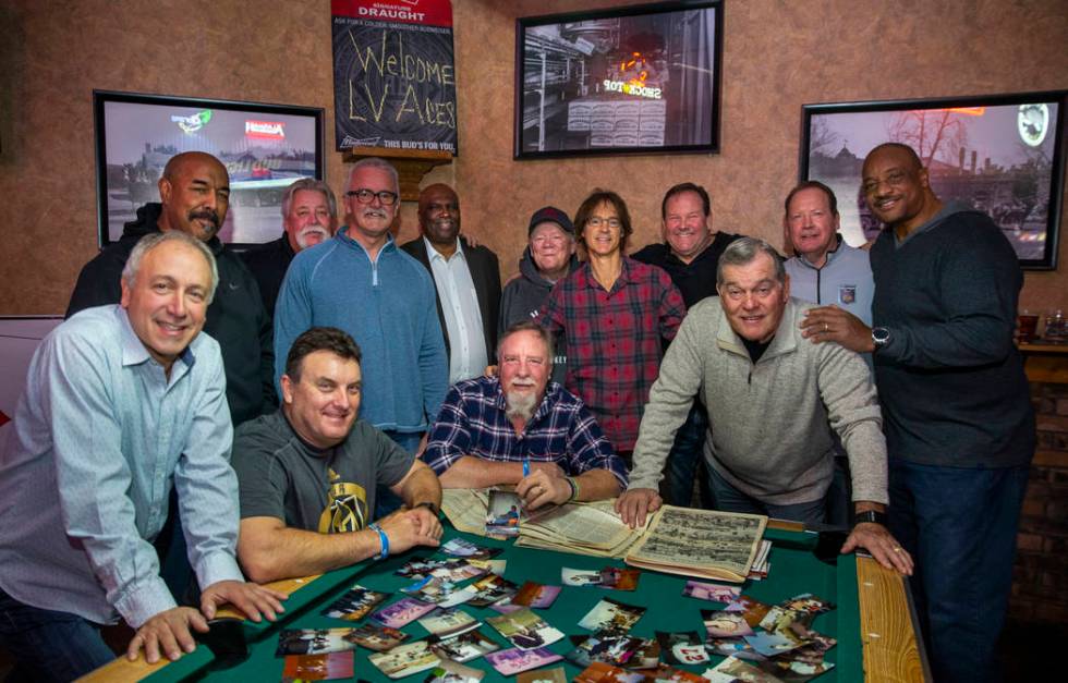 Former players and their sponsor's son gather for a photo during the Las Vegas Aces slow-pitch ...