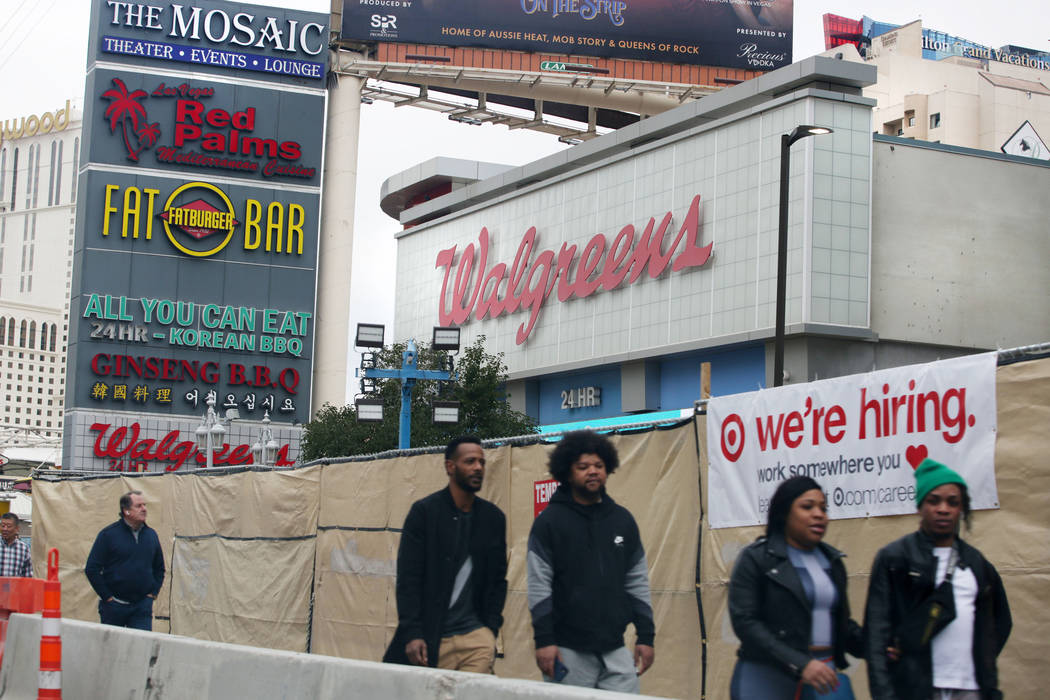 Pedestrians pass the Walgreens on the Strip located at 3765 Las Vegas Blvd. South on Monday, Ja ...