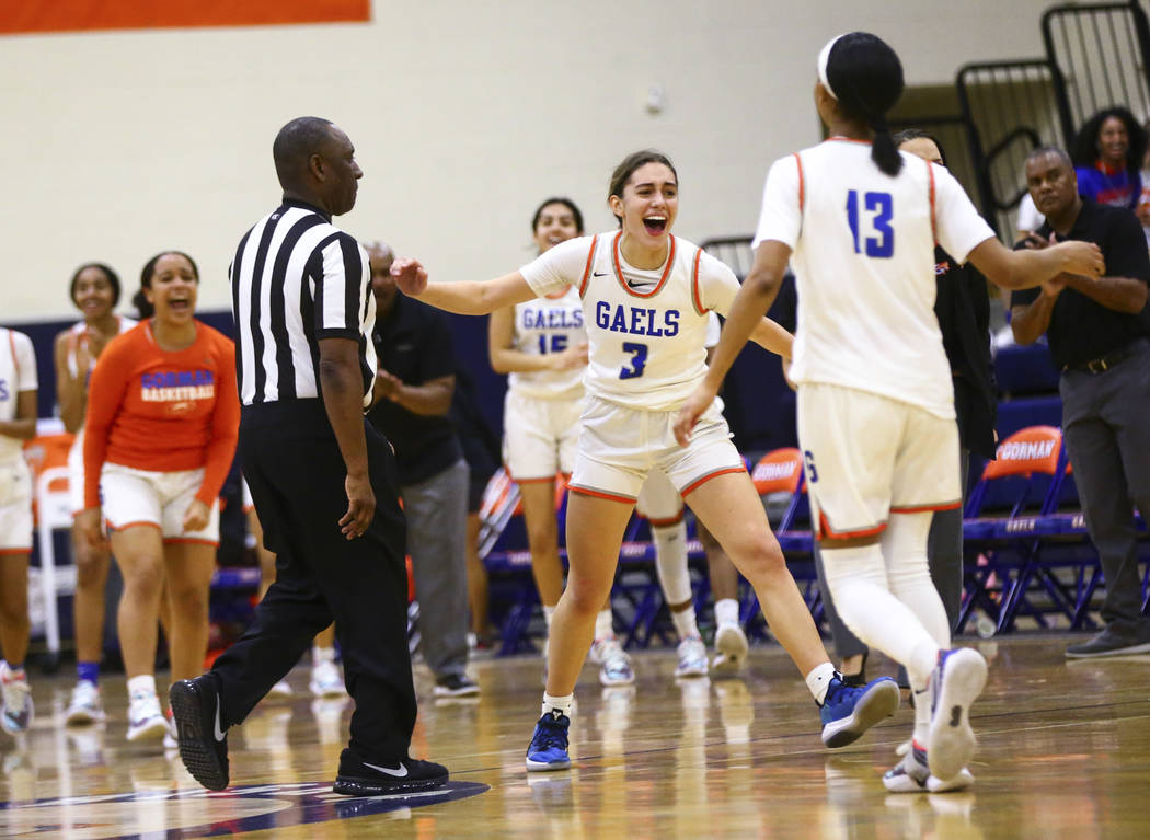 Bishop Gorman's Izzy Westbrook (3) celebrates at the end of the first half of a basketball game ...