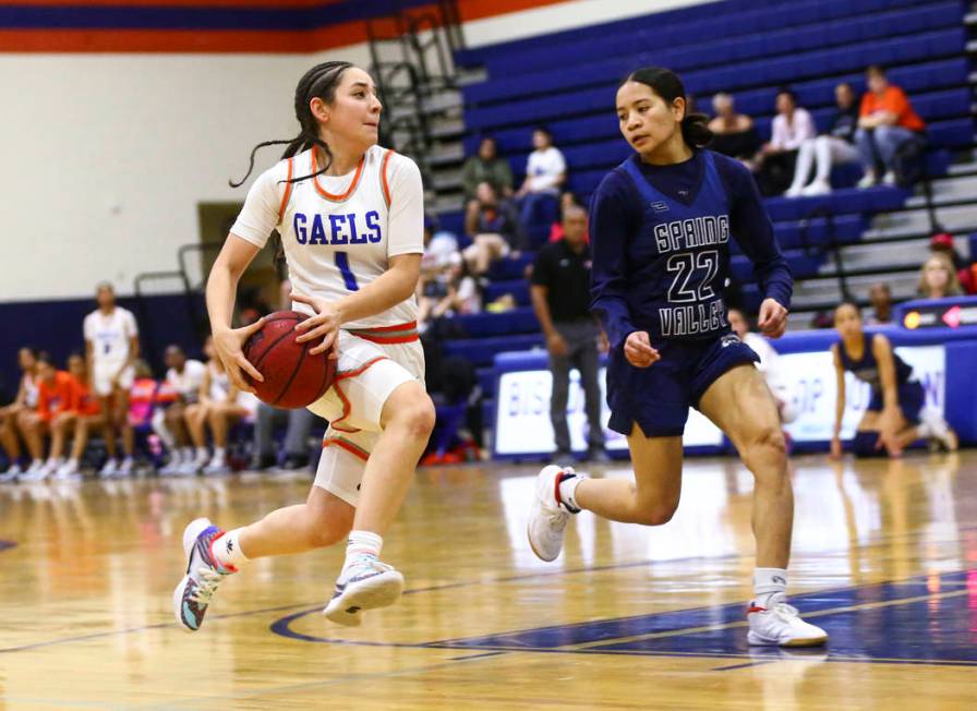 Bishop Gorman's Selina Gutierrez (1) drives to the basket against Spring Valley's Missy Valdez ...