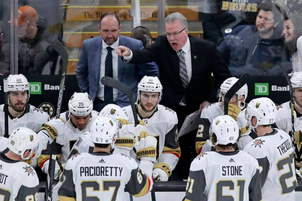 Vegas Golden Knights assistant coach Ryan McGill, right, yells at his players while head coach ...