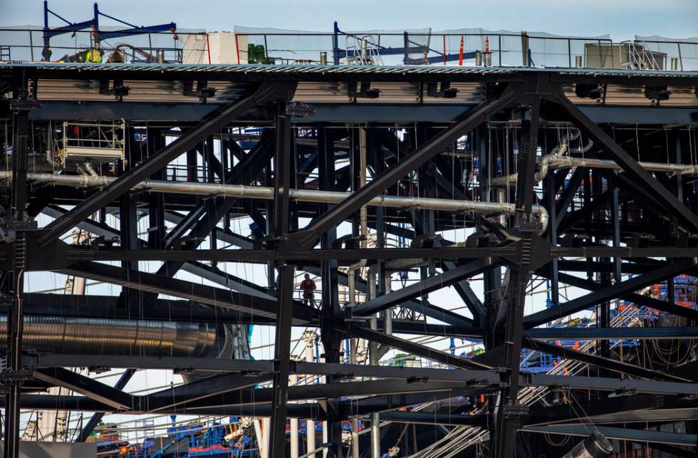 A worker looks on from the Allegiant Stadium during a special announcement in Las Vegas, Wednes ...