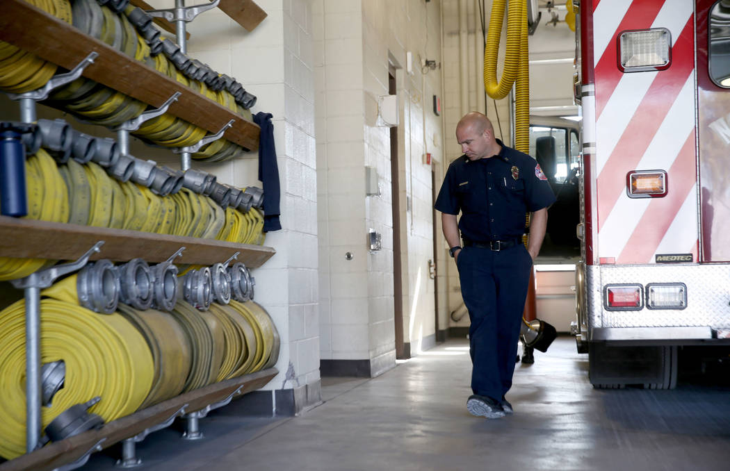 North Las Vegas Fire Capt. Ben Bodine shows damage, left, at Station 53 on West Gowan Road near ...