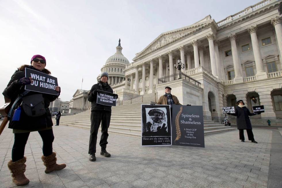 Demonstrators protest outside of the U.S. Capitol during the impeachment trial of President Don ...