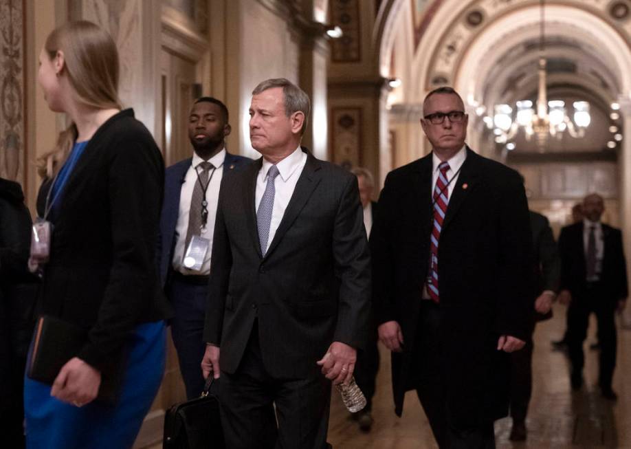 Chief Justice John Roberts departs the U.S. Capitol Wednesday, Jan. 22, 2020, following argumen ...