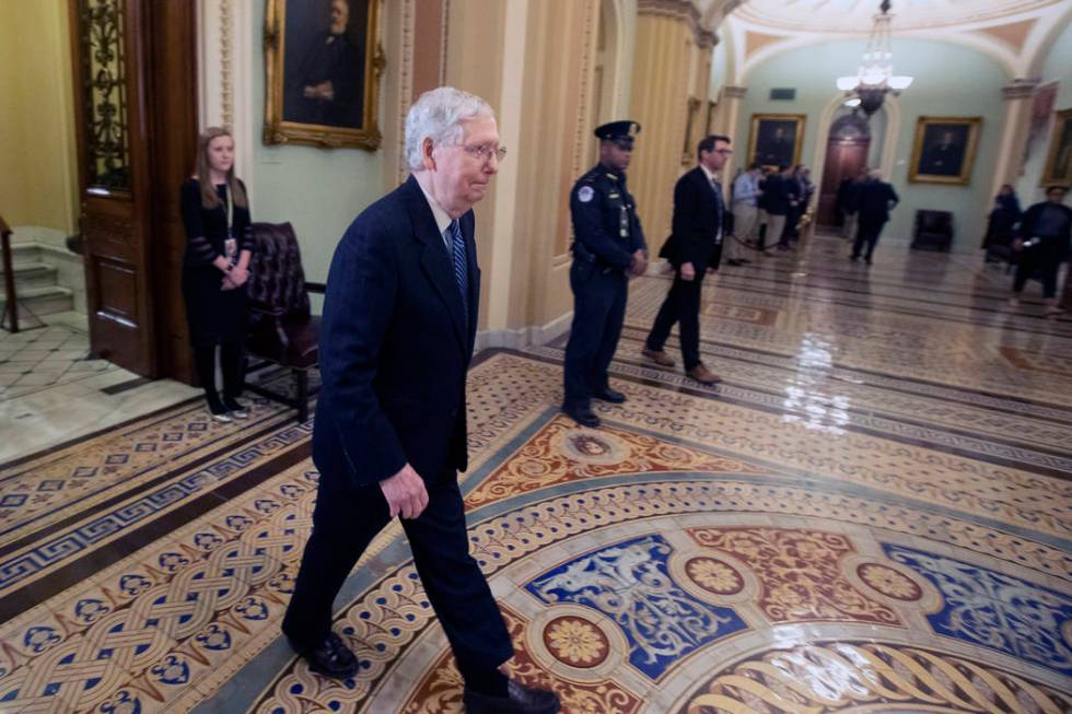 Senate Majority Leader Mitch McConnell, R-Ky., leaves the Senate chamber after the impeachment ...