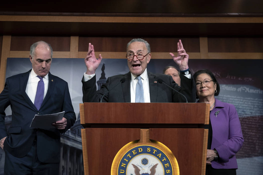 Senate Minority Leader Chuck Schumer, D-N.Y., joined from left by Sen. Bob Casey, D-Pa., Sen. T ...