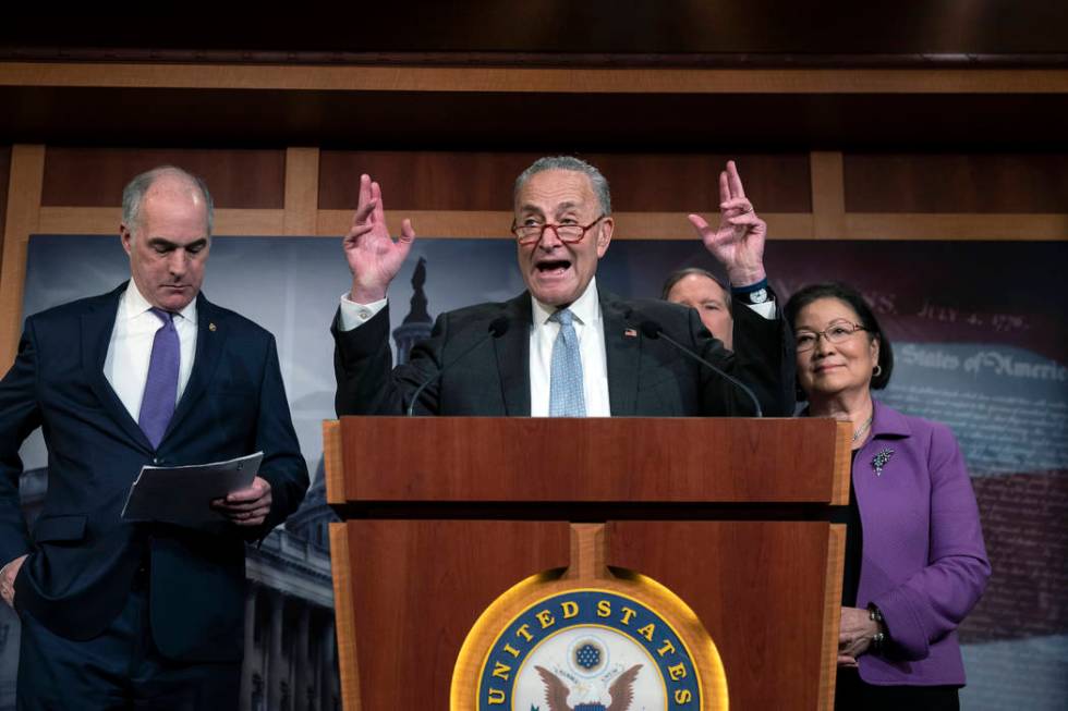 Senate Minority Leader Chuck Schumer, D-N.Y., joined from left by Sen. Bob Casey, D-Pa., Sen. T ...