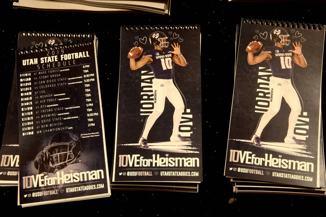 Notebooks promoting Utah State quarterback Jordan Love as a Heisman Trophy candidate sits among ...