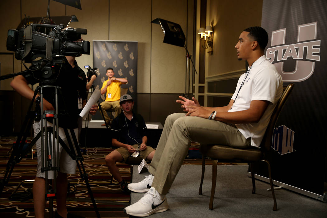 Utah State quarterback Jordan Love talks to reporters during Mountain West football media days ...