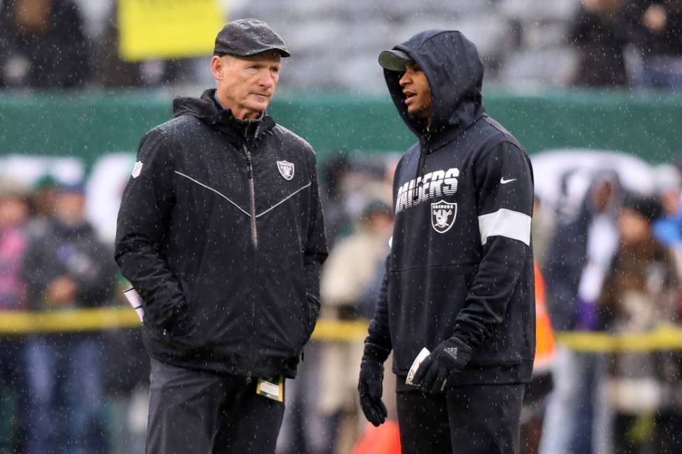 Oakland Raiders general manager Mike Mayock and safety Johnathan Abram (24) have a discussion o ...