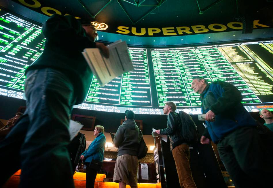 Bettors wait in line at Westgate Sportsbook as Super Bowl prop bets are listed on Thursday, Jan ...