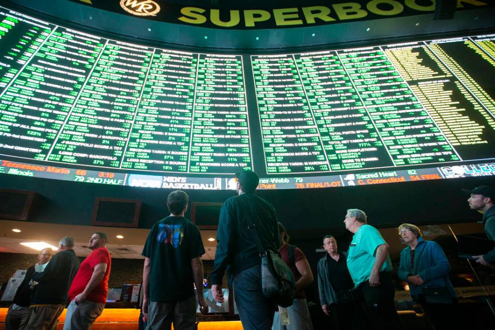 Bettors wait in line at Westgate Sportsbook as Super Bowl prop bets are listed on Thursday, Jan ...