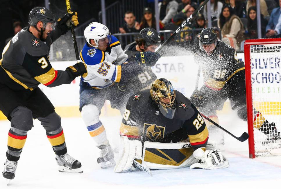 Golden Knights goaltender Marc-Andre Fleury (29) blocks the puck in front of St. Louis Blues' D ...