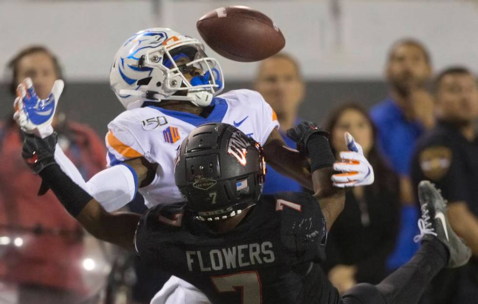 Boise State Broncos wide receiver John Hightower (16) fights for a deflected pass with UNLV Reb ...