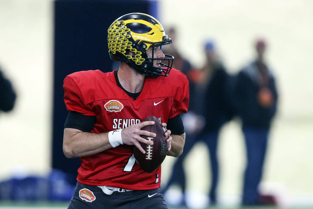 Michigan's Shea Patterson looks to pass as the North squad practices for the Senior Bowl Thursd ...