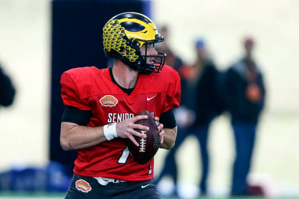 Michigan's Shea Patterson looks to pass as the North squad practices for the Senior Bowl Thursd ...