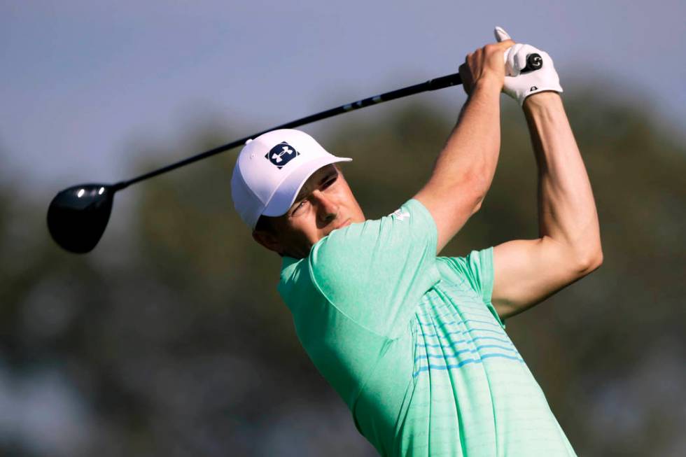 Jordan Spieth chips up to the second green on the Torrey Pines South Course during the first ro ...