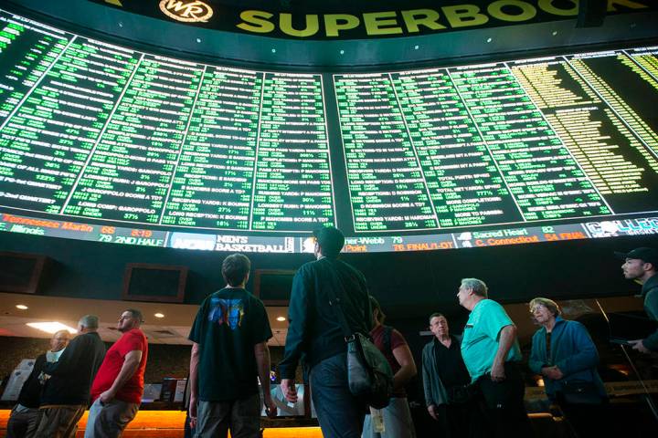 Bettors wait in line at Westgate Sportsbook as Super Bowl prop bets are listed on Thursday, Jan ...