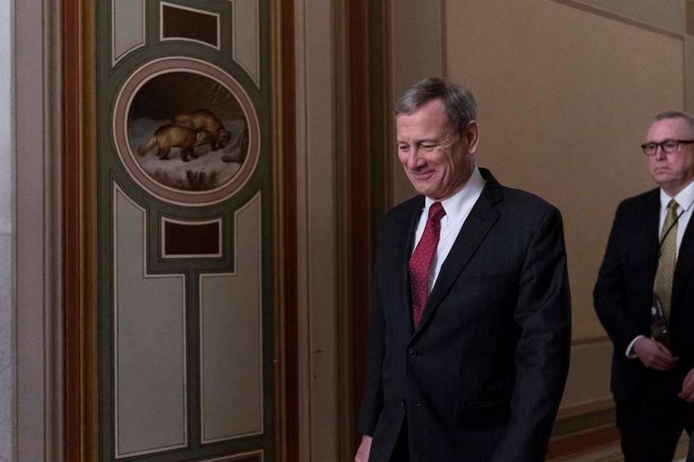 Chief Justice of the United States John Roberts departs the Capitol as the Senate finishes its ...