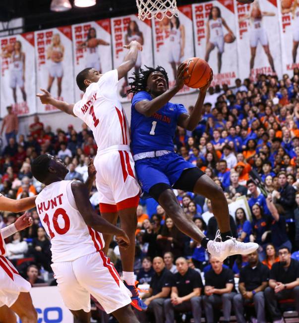 Bishop Gorman's Will McClendon (1) goes to the basket past Coronado's Jaden Hardy (1) during th ...