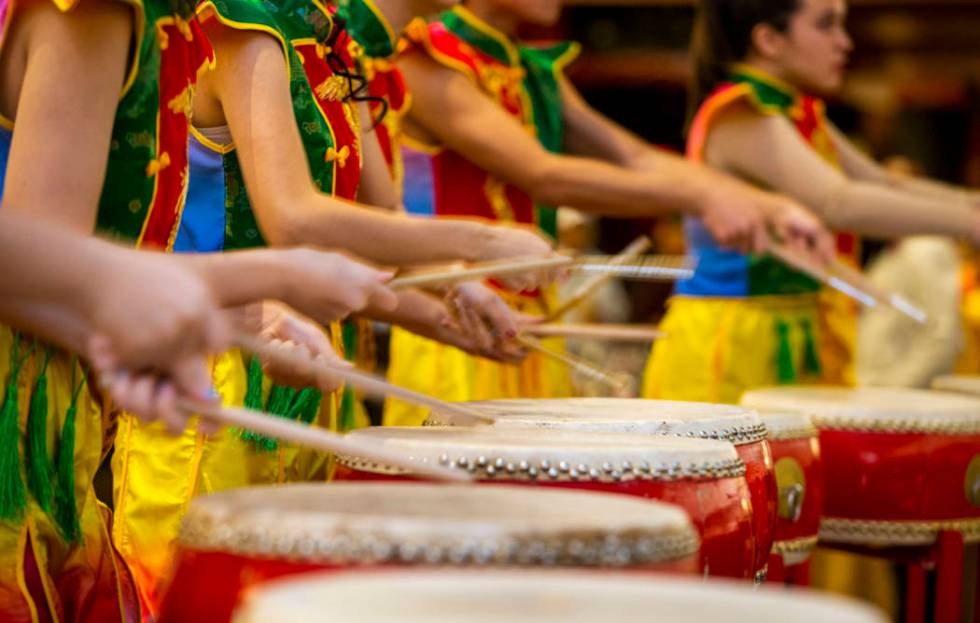 Members of the Li Ling Hong drum group perform at a reception as the Grand Canal Shoppes celebr ...