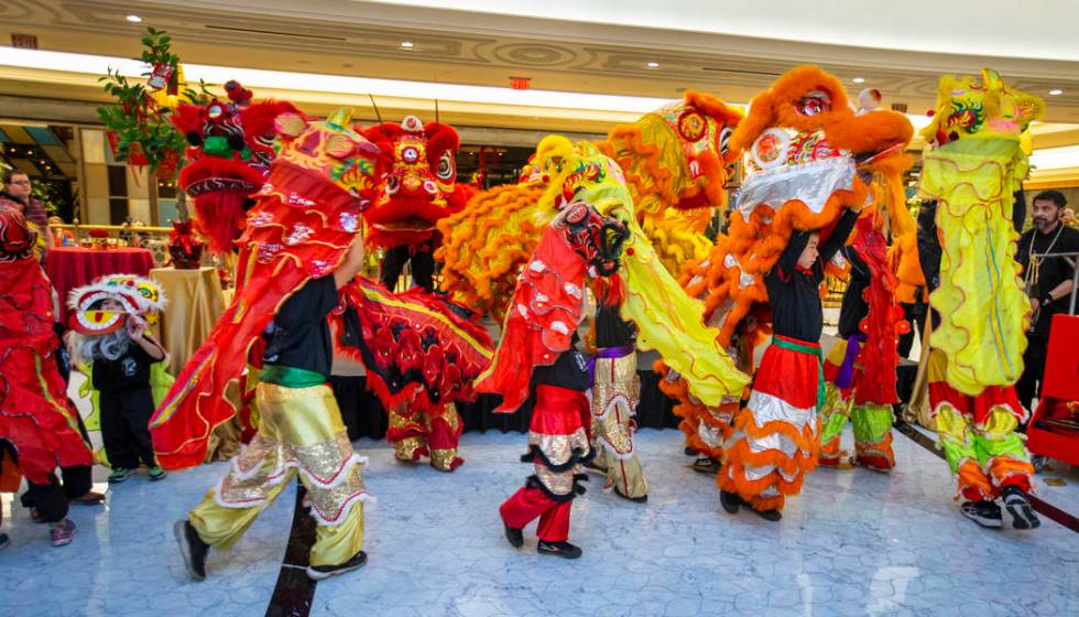 The Lohan School of Shaolin conduct a lion dance at a reception as the Grand Canal Shoppes cele ...