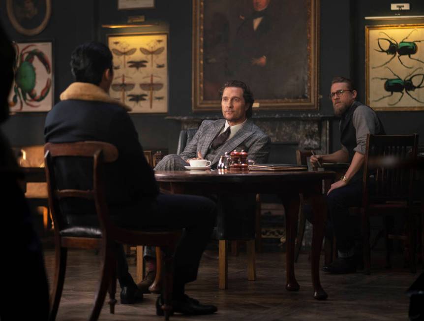 This image released by STXfilms shows, from left, Henry Golding, Matthew McConaughey and Charli ...