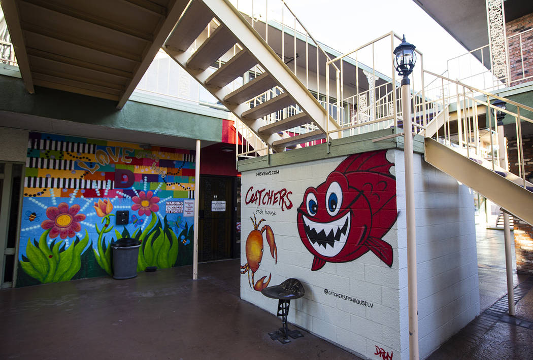 A view of a pair of murals in New Orleans Square in Las Vegas on Tuesday, Jan. 28, 2020. (Chase ...