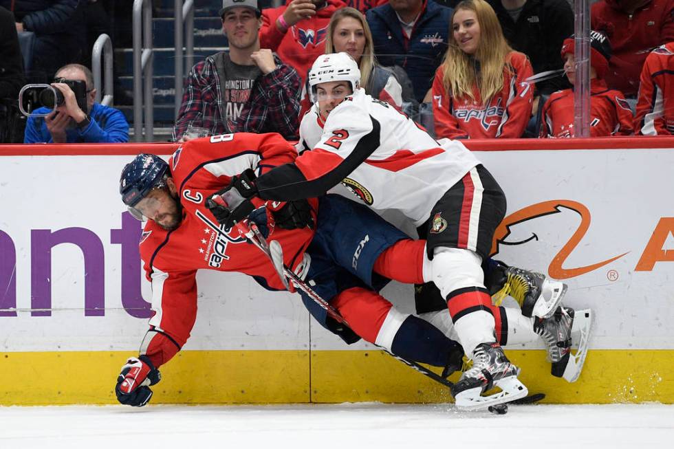 Ottawa Senators defenseman Dylan DeMelo (2) collides into Washington Capitals left wing Alex Ov ...