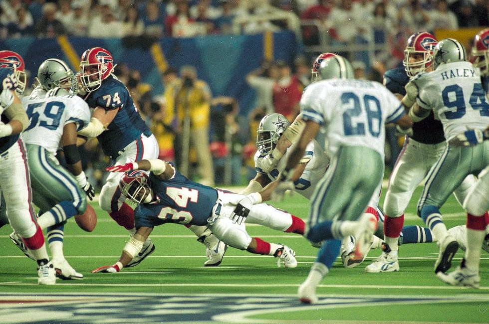 Buffalo Bills running back Thurman Thomas (34) fumbles the ball during the third quarter of Sup ...