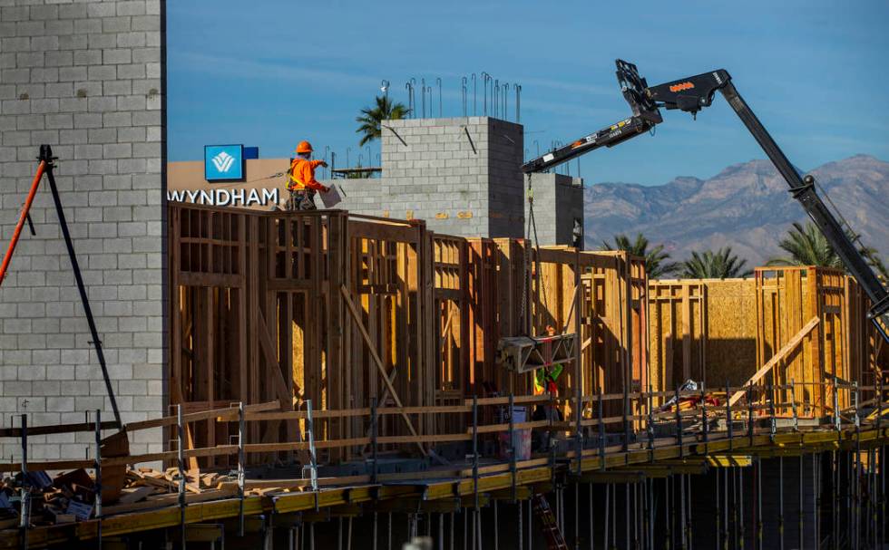 Framers continue on a new apartment complex by developer Jonathan Fore currently under construc ...