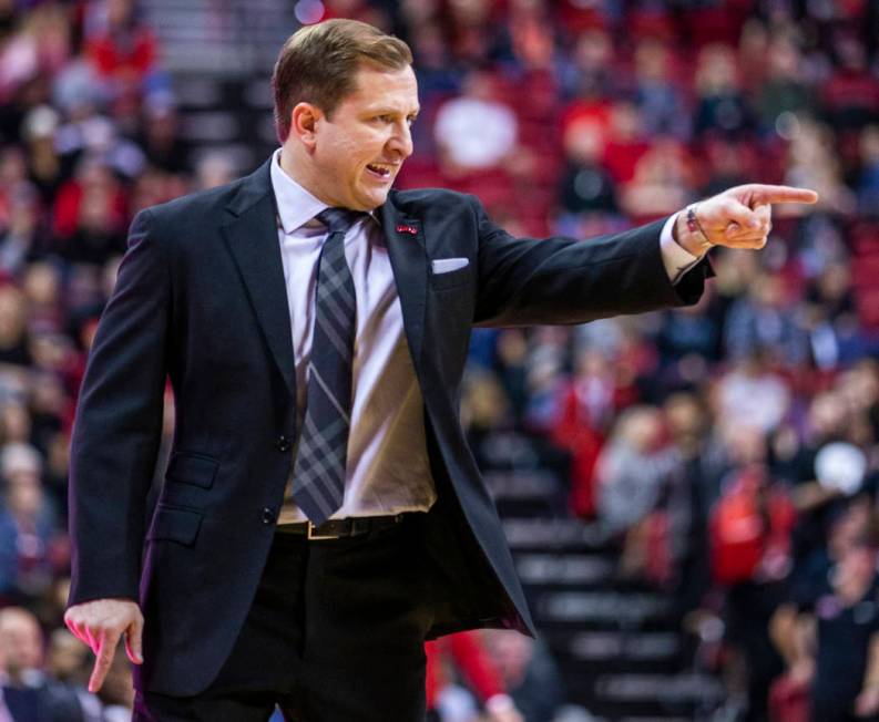 UNLV Rebels head coach T.J.Otzelberger directs his players on the court versus the New Mexico L ...