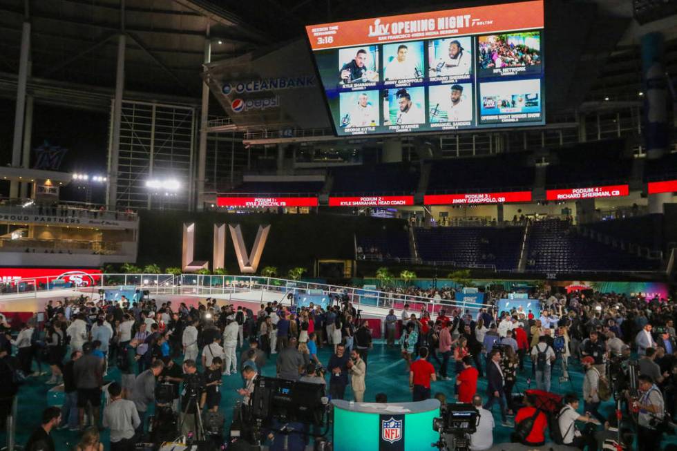 Fans and media attend Super Bowl LIV Opening Night in Marlins Park in Miami, Fla., Monday, Jan. ...