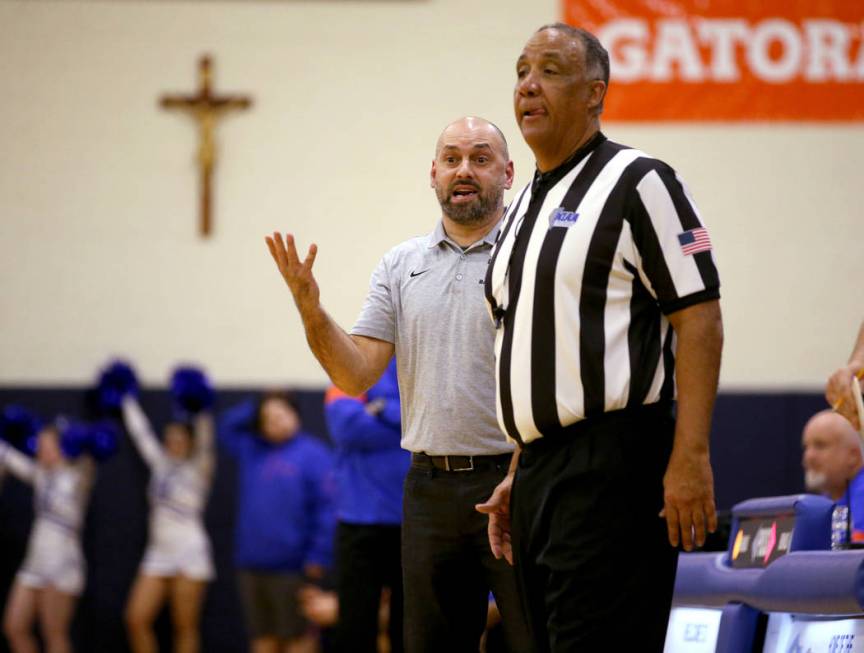 Durango coach in the Chad Beeten argues a call in the second quarter of a basketball game agai ...