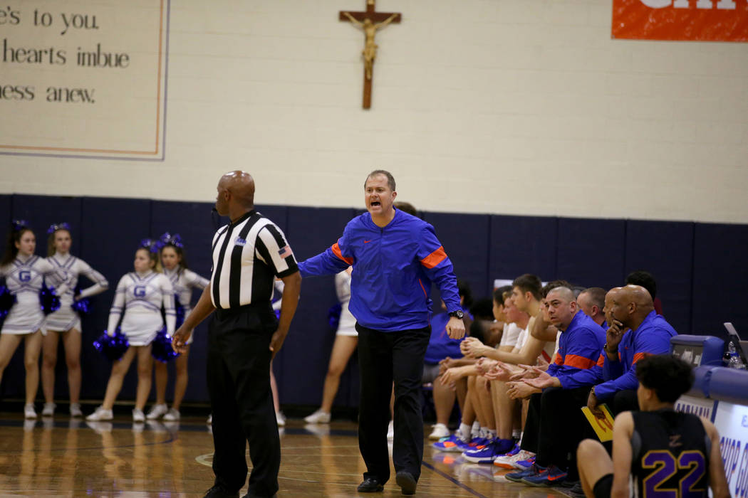 Bishop Gorman head coach Grant Rice argues a call in the third quarter of their basketball game ...