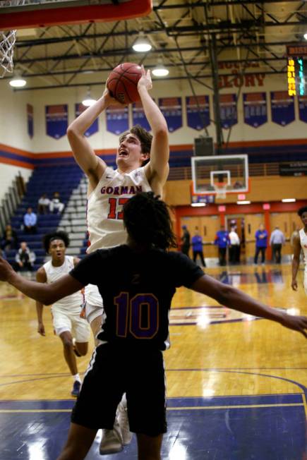 Bishop Gorman forward Braden Lamar (13) shoots over Durango guard Keshon Gilbert (10) in the fo ...