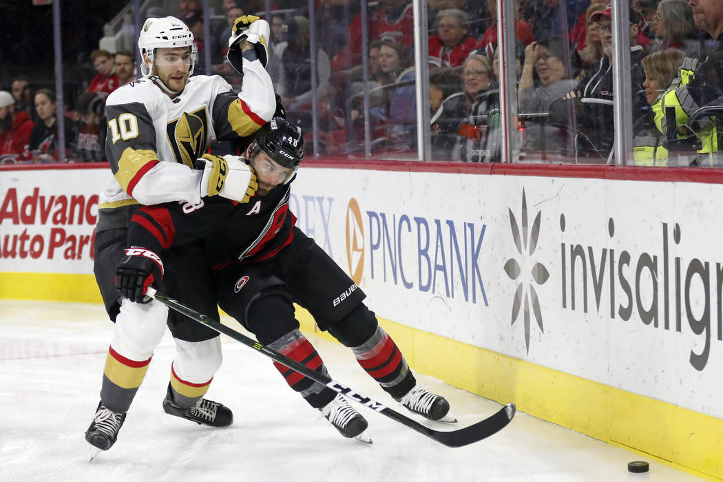 Vegas Golden Knights center Nicolas Roy (10) and Carolina Hurricanes left wing Jordan Martinook ...